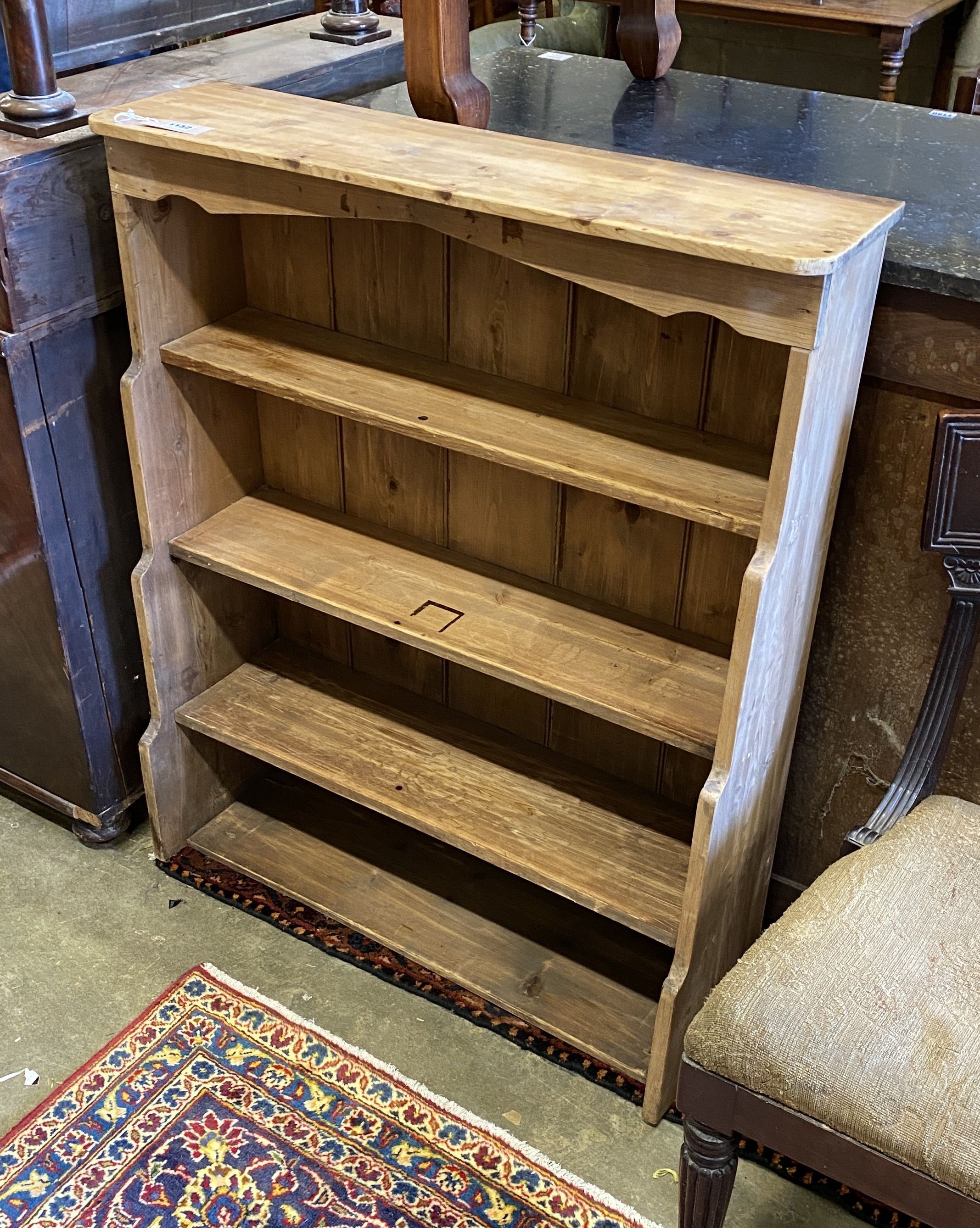 A Victorian pine open bookcase, width 83cm, depth 27cm, height 100cm